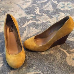 Mustard suede wedge heels.